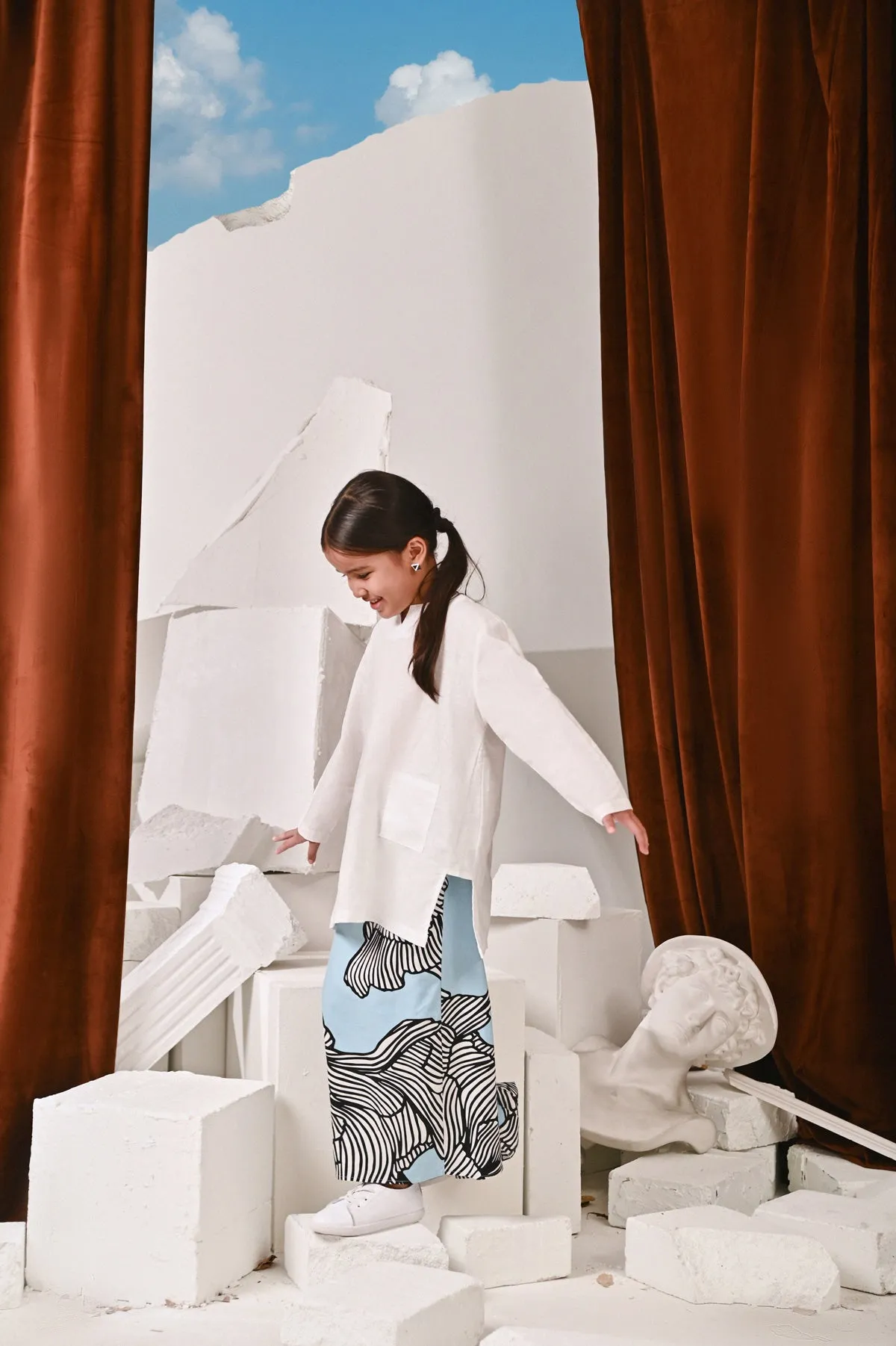 The Kita Menang Back Pleats Skirt - Rise